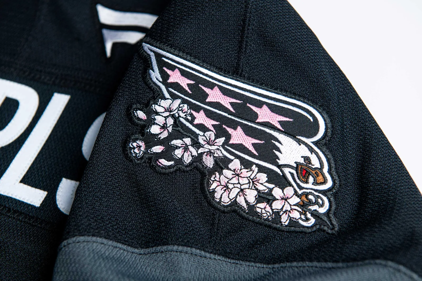 The Screaming Eagle patch sitting on the shoulder of the new sweater