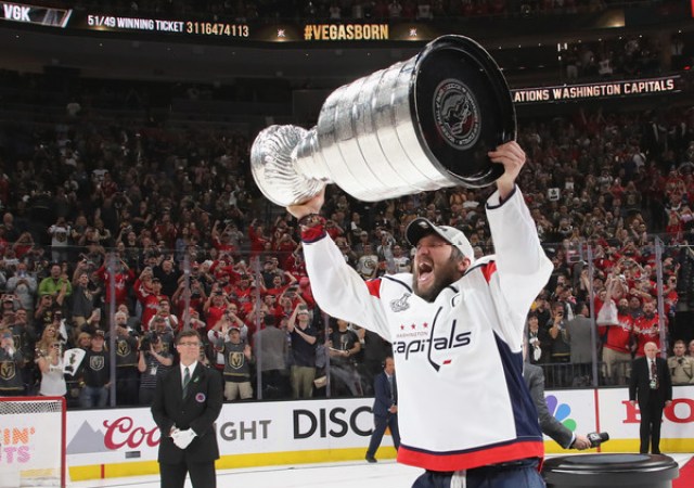 Alex Ovechkin receives mini trophies for winning Stanley Cup and